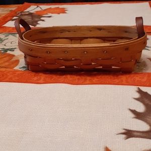 Preowned small oval basket with leather handles
